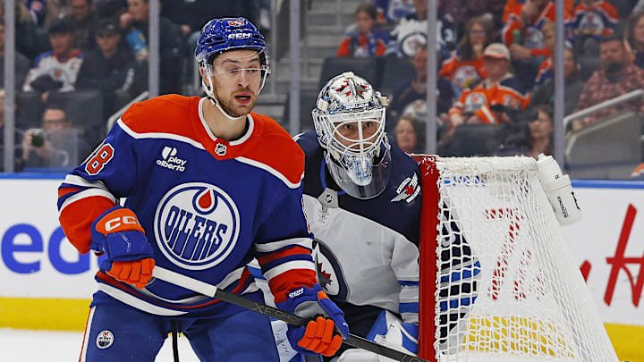 Sep 26, 2025; Edmonton, Alberta, CAN; Edmonton Oilers forward Andrew Mangiapane (88) looks for a pass in front of Winnipeg Jets goaltender Domenic DiVincentiis (50) during the first period at Rogers Place. Mandatory Credit: Perry Nelson-Imagn Images
