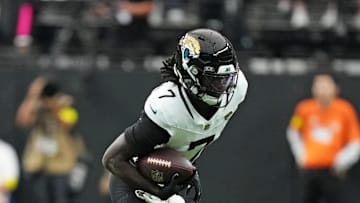 Nov 2, 2025; Paradise, Nevada, USA; Las Vegas Raiders cornerback Darien Porter (26) tackles Jacksonville Jaguars wide receiver Brian Thomas Jr. (7) during the first half at Allegiant Stadium. Mandatory Credit: Kirby Lee-Imagn Images