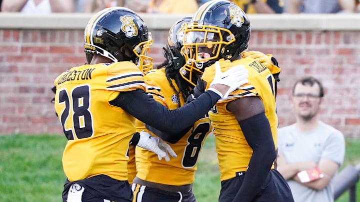 Oct 22, 2022; Columbia, Missouri, USA; Missouri Tigers defensive back Jaylon Carlies (1) celebrates with defensive back Joseph Charleston (28) and linebacker Ty'Ron Hopper (8) after making an interception in the end zone against the Vanderbilt Commodores during the first half of the game at Faurot Field at Memorial Stadium. Mandatory Credit: Denny Medley-Imagn Images