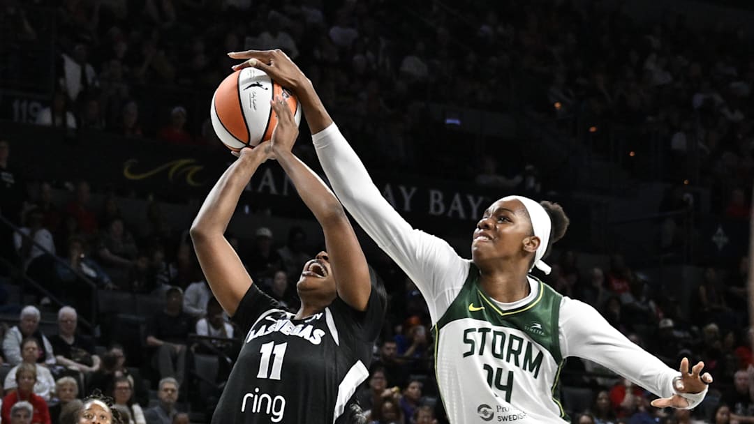 Sep 18, 2025; Las Vegas, Nevada, USA; Seattle Storm center Dominique Malonga (14) blocks a shot from Las Vegas Aces guard Dana Evans (11) in the first quarter during game three of round one for the 2025 WNBA Playoffs at Michelob Ultra Arena. Mandatory Credit: Candice Ward-Imagn Images