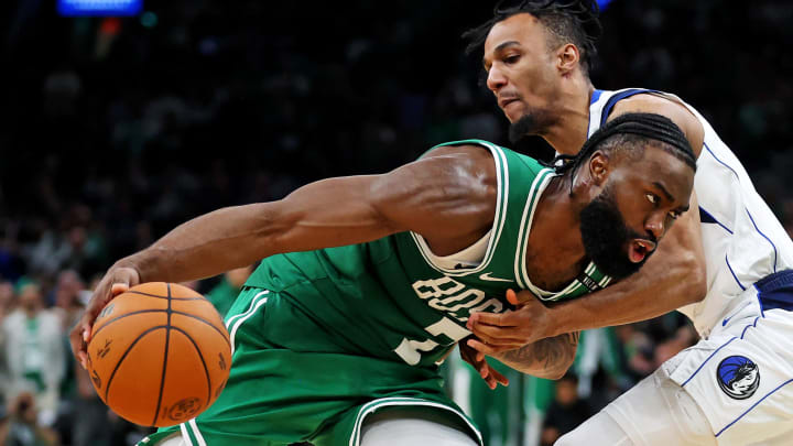 Jun 17, 2024; Boston, Massachusetts, USA; Boston Celtics guard Jaylen Brown (7) drives to the basket against Dallas Mavericks guard A.J. Lawson (9) in game five of the 2024 NBA Finals at TD Garden. Mandatory Credit: Peter Casey-USA TODAY Sports