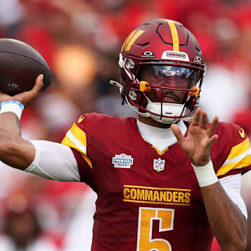 Washington Commanders quarterback Jayden Daniels (5) drops back to pass against the Tampa Bay Buccaneers in the third quarter at Raymond James Stadium. Mandatory Credit: Nathan Ray Seebeck-Imagn Images