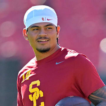 Oct 11, 2025; Los Angeles, California, USA;  USC Trojans quarterback Jayden Maiava (14) warms up prior to the game against the Michigan Wolverines at United Airlines Field at the Los Angeles Memorial Coliseum. Mandatory Credit: Jayne Kamin-Oncea-Imagn Images