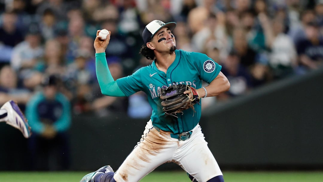 Seattle Mariners third baseman Josh Rojas (4) throws to second against the Minnesota Twins during the sixth inning at T-Mobile Park in 2024.