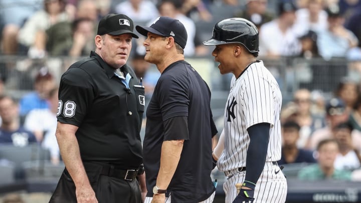 Jun 23, 2024; Bronx, New York, USA;  New York Yankees manager Aaron Boone (17) and  right fielder Juan Soto (22) argue with umpire Chris Conroy (98) in the eighth inning against the Atlanta Braves at Yankee Stadium. Mandatory Credit: Wendell Cruz-USA TODAY Sports