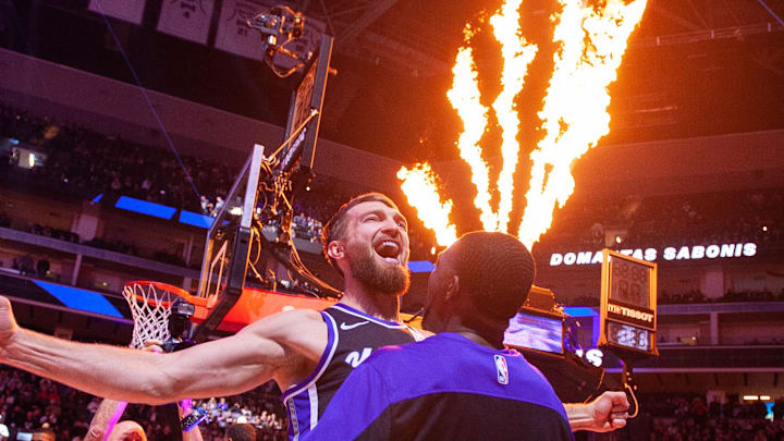 Nov 6, 2024; Sacramento, California, USA; Sacramento Kings forward Domantas Sabonis (11) and guard De'Aaron Fox (5) bump chests during pregame introductions at Golden 1 Center. Mandatory Credit: Ed Szczepanski-Imagn Images