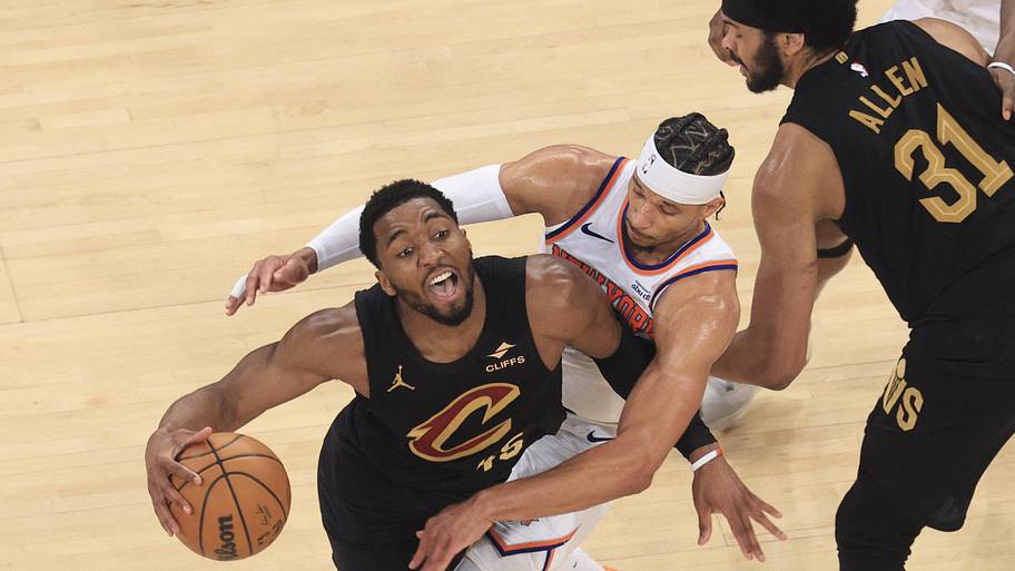 Cleveland Cavaliers guard Donovan Mitchell drives against New York Knicks guard Josh Hart.