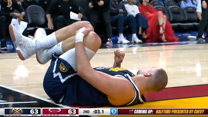 Nikola Jokic suffered an injury against the Miami Heat. Nikola Jokic suffered an injury against the Miami Heat.