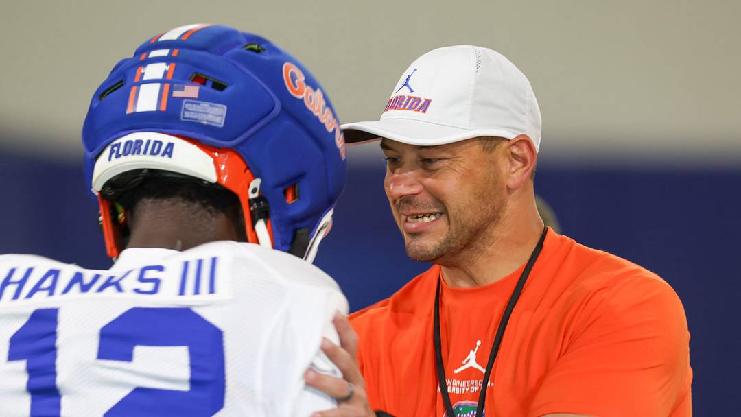Florida head coach Jon Sumrall talks with Florida cornerback Ben Hanks II (12) during practice during spring practice at Sanders Practice Fields in Gainesville, FL on Thursday, April 2, 2026. [Alan Youngblood/Gainesville Sun]