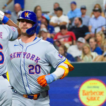 Jun 19, 2024; Arlington, Texas, USA; New York Mets first baseman Pete Alonso (20) celebrates with New York Mets right fielder Starling Marte (6) after hitting a two-run home run during the sixth inning against the Texas Rangers at Globe Life Field. Mandatory Credit: Kevin Jairaj-USA TODAY Sports