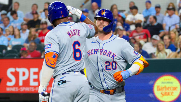 Jun 19, 2024; Arlington, Texas, USA; New York Mets first baseman Pete Alonso (20) celebrates with New York Mets right fielder Starling Marte (6) after hitting a two-run home run during the sixth inning against the Texas Rangers at Globe Life Field. Mandatory Credit: Kevin Jairaj-USA TODAY Sports