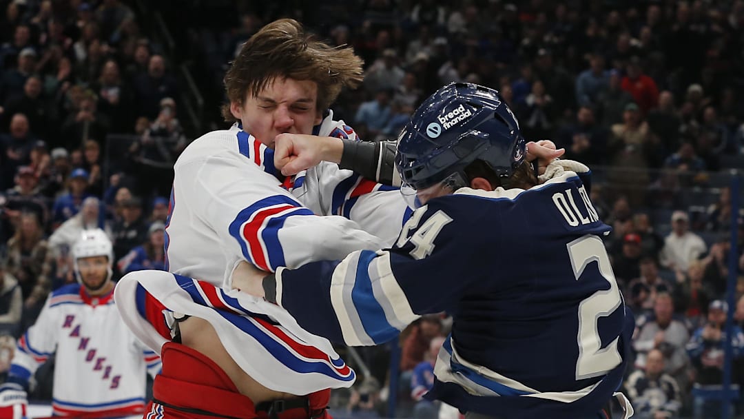 Mathieu Olivier lands a punch on Matt Rempe during a fight