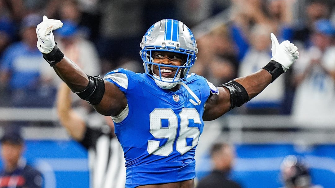 Detroit Lions linebacker Al-Quadin Muhammad (96) celebrates a tackle against Chicago Bears during the second half at Ford Field in Detroit on Sunday, Sept. 14, 2025.
