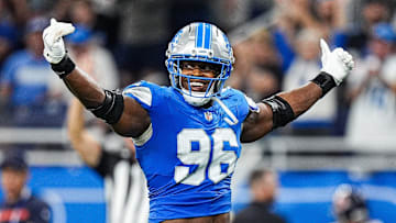 Detroit Lions linebacker Al-Quadin Muhammad (96) celebrates a tackle against Chicago Bears during the second half at Ford Field in Detroit on Sunday, Sept. 14, 2025.