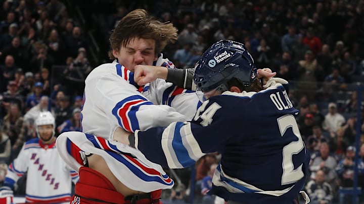 Mathieu Olivier lands a punch on Matt Rempe during a fight