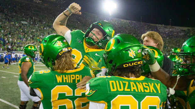 Oregon kicker Atticus Sappington is hoisted into the air after kicking the game winning field goal as the Oregon Ducks host t