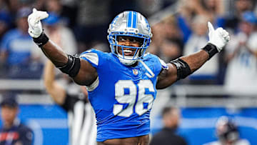 Detroit Lions linebacker Al-Quadin Muhammad (96) celebrates a tackle against Chicago Bears during the second half at Ford Field in Detroit on Sunday, Sept. 14, 2025.