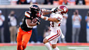 Oklahoma State's Rashod Owens (10) stiff arms Oklahoma's Jasiah Wagoner (23) during a Bedlam college football game between the Oklahoma State University Cowboys (OSU) and the University of Oklahoma Sooners (OU) at Boone Pickens Stadium in Stillwater, Okla., Saturday, Nov. 4, 2023.
