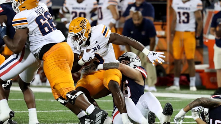 Sep 16, 2023; Tucson, Arizona, USA; Arizona Wildcats defensive lineman Ta'ita'i Uiagalelei (46) makes a tackle against UTEP Miners running back Deion Hankins (3) during the second half at Arizona Stadium. Mandatory Credit: Zachary BonDurant-USA TODAY Sports