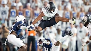 Oregon tight end Kenyon Sadiq hurdles over Penn State cornerback Audavion Collins as the Oregon Ducks face the Penn State Nittany Lions on Sept. 27, 2025, at Beaver Stadium in University Park, Pennsylvania.