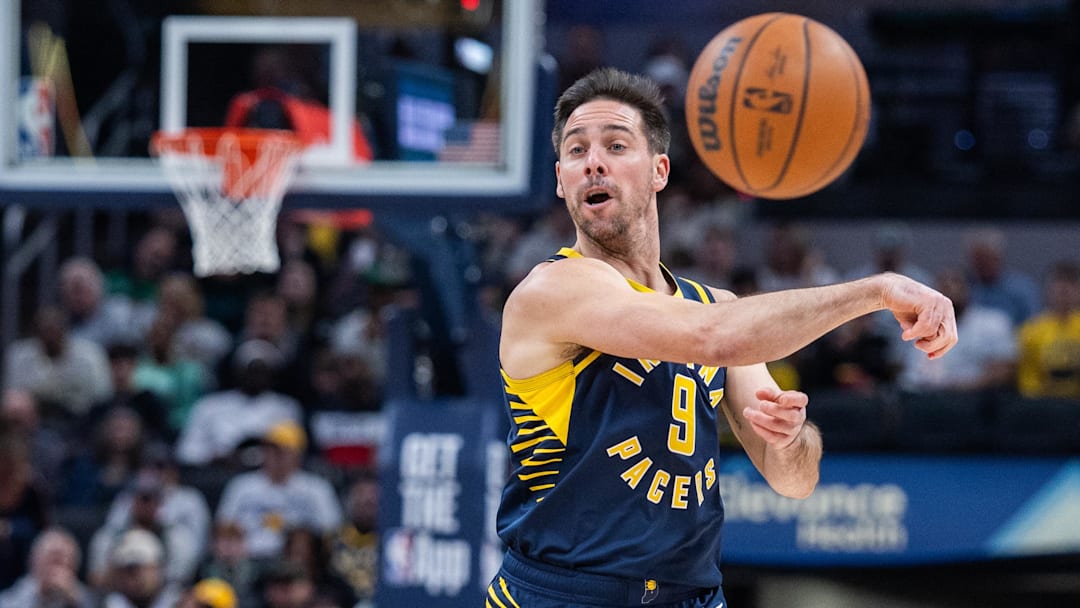 Jan 12, 2026; Indianapolis, Indiana, USA; Indiana Pacers guard T.J. McConnell (9) passes the ball  in the first half against the Boston Celtics at Gainbridge Fieldhouse. Mandatory Credit: Trevor Ruszkowski-Imagn Images