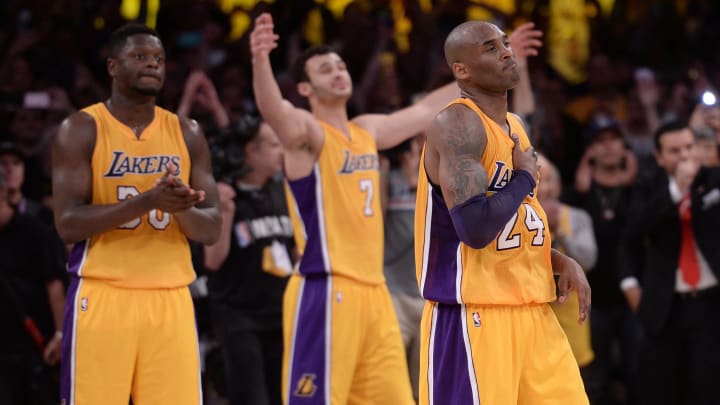 Apr 13, 2016; Los Angeles, CA, USA; Los Angeles Lakers guard Kobe Bryant (24) heads off the court after being replaced by Los Angeles Lakers forward Ryan Kelly (not pictured) in the final seconds of the Lakers win over the Utah Jazz at Staples Center. Bryant scored 60 points in the final game of his NBA career. Mandatory Credit: Robert Hanashiro-USA TODAY Sports