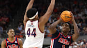 Feb 26, 2025; Auburn, Alabama, USA;  Auburn Tigers center Dylan Cardwell (44) tries to block the shot of Mississippi Rebels forward Malik Dia (0) during the first half at Neville Arena. Mandatory Credit: John Reed-Imagn Images
