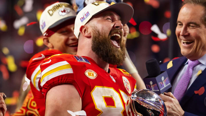 Feb 11, 2024; Paradise, Nevada, USA; Kansas City Chiefs tight end Travis Kelce (87) celebrates with the Vince Lombardi Trophy after defeating the San Francisco 49ers in Super Bowl LVIII at Allegiant Stadium. Mandatory Credit: Mark J. Rebilas-USA TODAY Sports