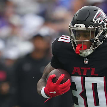 Atlanta Falcons running back Jase McClellan (30) gains yards against the Baltimore Ravens.