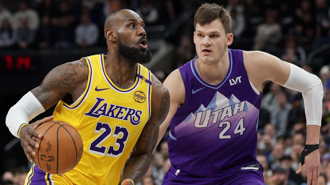 Los Angeles Lakers forward LeBron James (23) dribbles past Utah Jazz center Walker Kessler (24) during the first quarter at Delta Center.