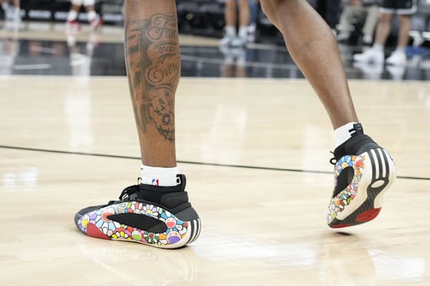San Antonio Spurs guard Blake Wesley's black and white adidas sneakers.