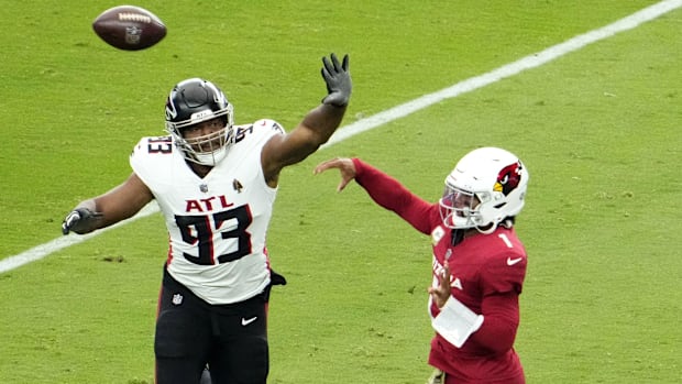 Arizona Cardinals quarterback Kyler Murray (1) throws a pass with pressure from Atlanta Falcons