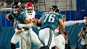 Jacksonville Jaguars quarterback Trevor Lawrence gets a key block from Ezra Cleveland. 