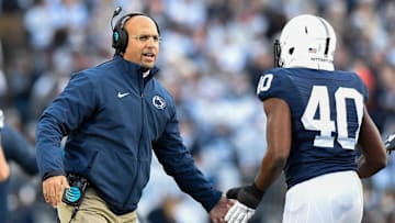 Penn State Nittany Lions head coach James Franklin greets Penn State Nittany Lions linebacker Jason Cabinda (40)
