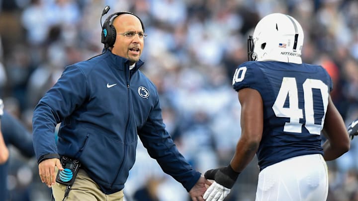 Penn State Nittany Lions head coach James Franklin greets Penn State Nittany Lions linebacker Jason Cabinda (40)