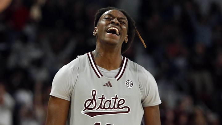 Feb 21, 2024; Starkville, Mississippi, USA; Mississippi State Bulldogs forward KeShawn Murphy (12) reacts after a three point basket during the second half against the Mississippi Rebels at Humphrey Coliseum. Mandatory Credit: Petre Thomas-Imagn Images
