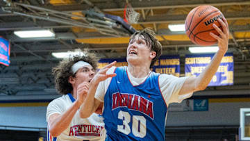 Indiana Junior All-Star Braylon Mullins (30) goes for a layup against Kentucky Junior All-Star Maddox Huff (8) during their game on Sunday, June 2, 2024 in Scottsburg, Ind. at Charles E. Meyer Gymnasium for the first game of the Indiana vs Kentucky All-Stars basketball week.