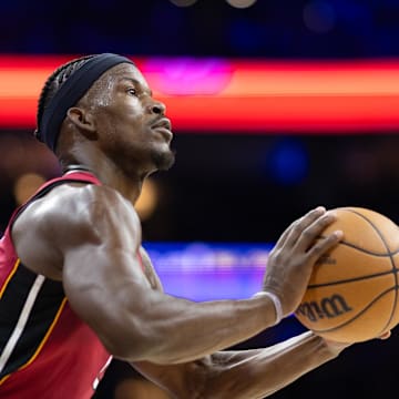 Apr 17, 2024; Philadelphia, Pennsylvania, USA; Miami Heat forward Jimmy Butler (22) lines up a shot against the Philadelphia 76ers during the second quarter of a play-in game of the 2024 NBA playoffs at Wells Fargo Center. Mandatory Credit: Bill Streicher-Imagn Images