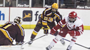 Wisconsin's Jack Gorniak (11) tries to get a shot past Minnesota goalie Justen Close (1) during the team's hockey game at the Kohl Center in Madison, Wis. on Saturday Feb. 11, 2023. Wisconsin won, 3-1.

Uw Minnesota Hockey 1 Feb 11 2023