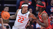 Jan 23, 2025; Champaign, Illinois, USA;  Illinois Fighting Illini guard Tre White (22) drives to the basket as Maryland Terrapins guard Selton Miguel (9) defends during the second half at State Farm Center. Mandatory Credit: Ron Johnson-Imagn Images