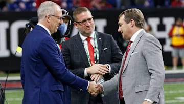SEC Commissioner Greg Sankey shakes hands with Georgia coach Kirby Smart at Lucas Oil Stadium before the College Football Playoff National Championship game in Indianapolis, on Monday, Jan. 10, 2022.