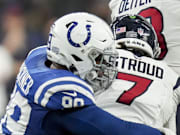 Jan 6, 2024; Indianapolis, Indiana, USA; Indianapolis Colts defensive tackle DeForest Buckner (99) sacks Houston Texans quarterback C.J. Stroud (7) at Lucas Oil Stadium. Mandatory Credit: Jenna Watson-Imagn Images