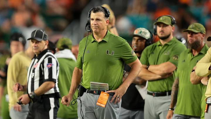 Oct 25, 2025; Miami Gardens, Florida, USA; Miami Hurricanes head coach Mario Cristobal watches from the sideline against the Stanford Cardinal during the fourth quarter at Hard Rock Stadium. Mandatory Credit: Sam Navarro-Imagn Images