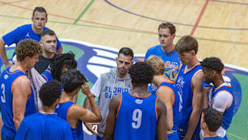 Florida head coach Todd Golden, center, gets the program started during afternoon basketball practice at the Florida Basketball Practice Facility in Gainesville, FL on Tuesday, September 30, 2025. [Alan Youngblood/Gainesville Sun]
