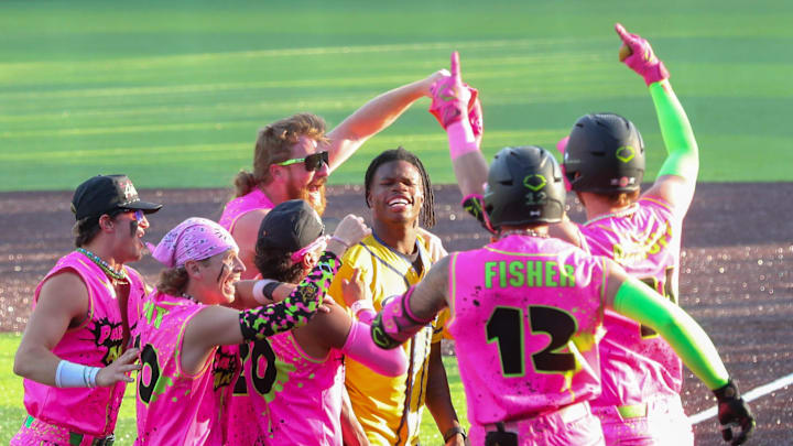 The Party Animals surround Heisman trophy winner Travis Hunter after he tossed out the first pitch during the Savannah Bananas game on Friday, April 11, 2025 at Historic Grayson Stadium. The Party Animals surround Heisman trophy winner Travis Hunter after he tossed out the first pitch during the Savannah Bananas game on Friday, April 11, 2025 at Historic Grayson Stadium.