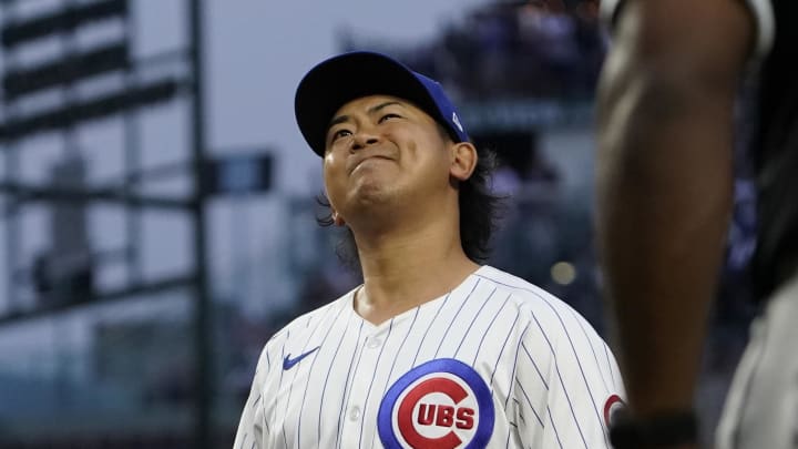 Jun 4, 2024; Chicago, Illinois, USA; Chicago Cubs pitcher Shota Imanaga (18) grimaces after giving up an infield single against the Chicago White Sox during the second inning at Wrigley Field.