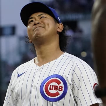 Jun 4, 2024; Chicago, Illinois, USA; Chicago Cubs pitcher Shota Imanaga (18) grimaces after giving up an infield single against the Chicago White Sox during the second inning at Wrigley Field.