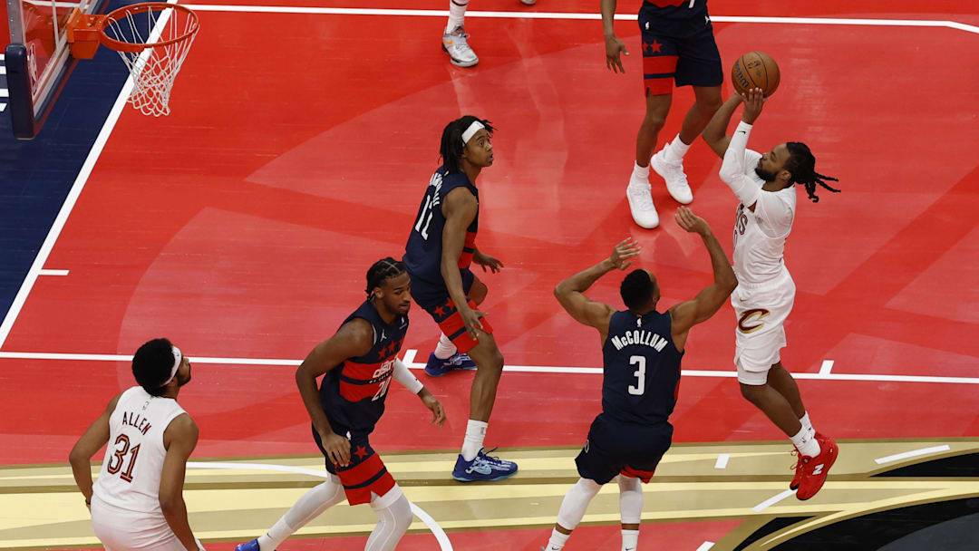 Nov 7, 2025; Washington, District of Columbia, USA; Cleveland Cavaliers guard Darius Garland (10) shoots the ball over Washington Wizards guard CJ McCollum (3) in the first half in an Emirates NBA Cup game at Capital One Arena. Mandatory Credit: Geoff Burke-Imagn Images
