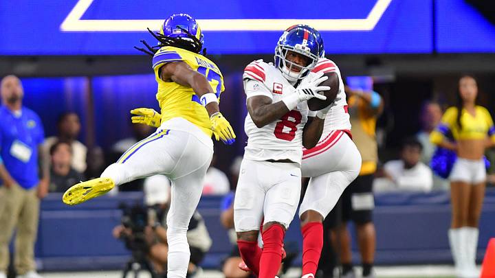 Sep 21, 2026; Inglewood, California, USA;  New York Giants safety Jevon Holland (8) makes an interception against Los Angeles Rams wide receiver Davante Adams (17) during the second quarter at SoFi Stadium.  Mandatory Credit: Gary A. Vasquez-Imagn Images