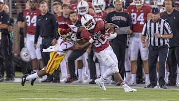 Sep 8, 2018; Stanford, CA, USA; Stanford Cardinal running back Bryce Love (20) is tackled by USC Trojans safety Marvell Tell III (7) during the fourth quarter at Stanford Stadium. Mandatory Credit: Neville E. Guard-Imagn Images
